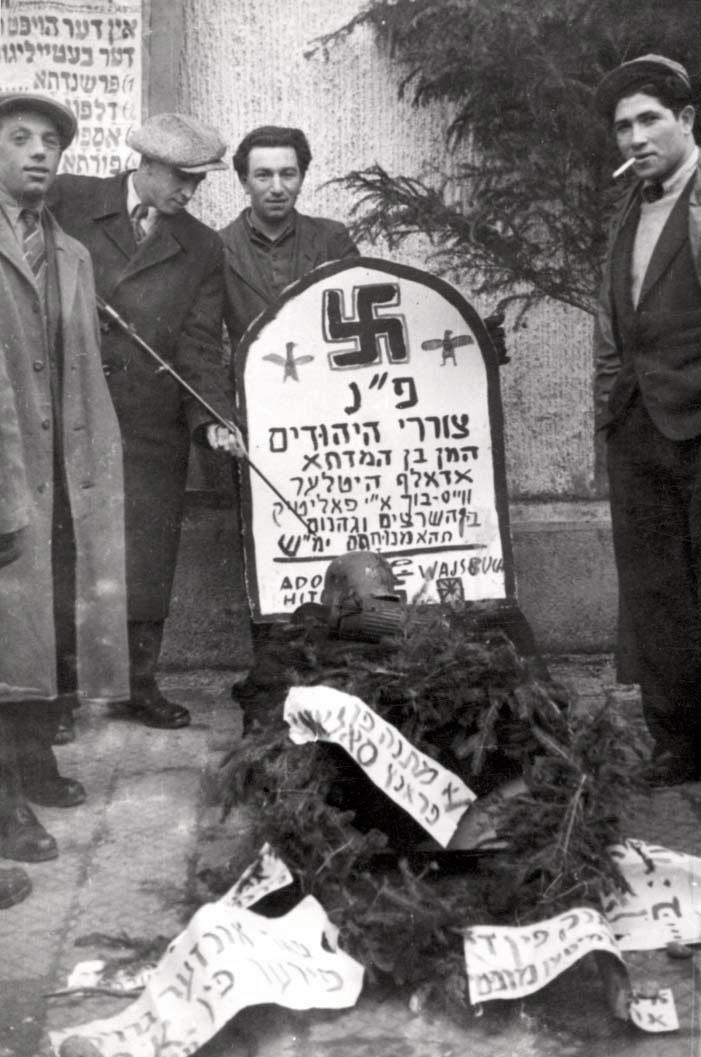 On the occasion of Purim, Holocaust survivors in the Landsberg DP camp in Germany made a mock-tombstone for Haman (a traditional enemy of the Jewish people and the antagonist of the Purim story) and Hitler